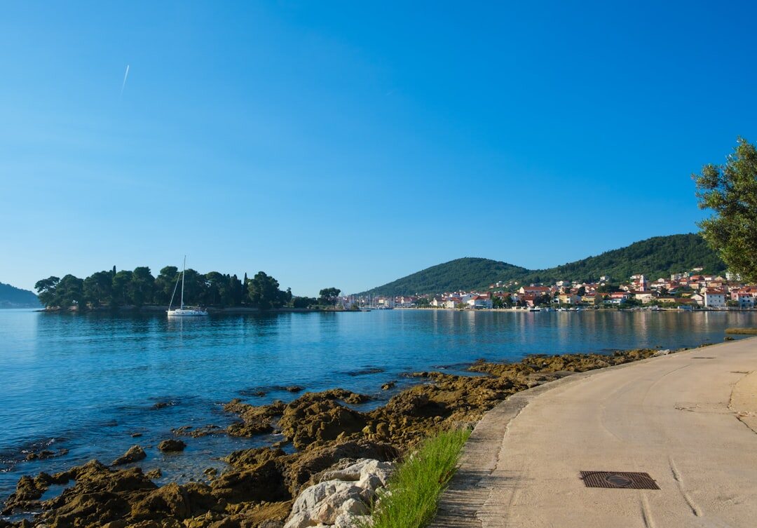 Narrow stone streets of an old Croatian coastal town at dusk